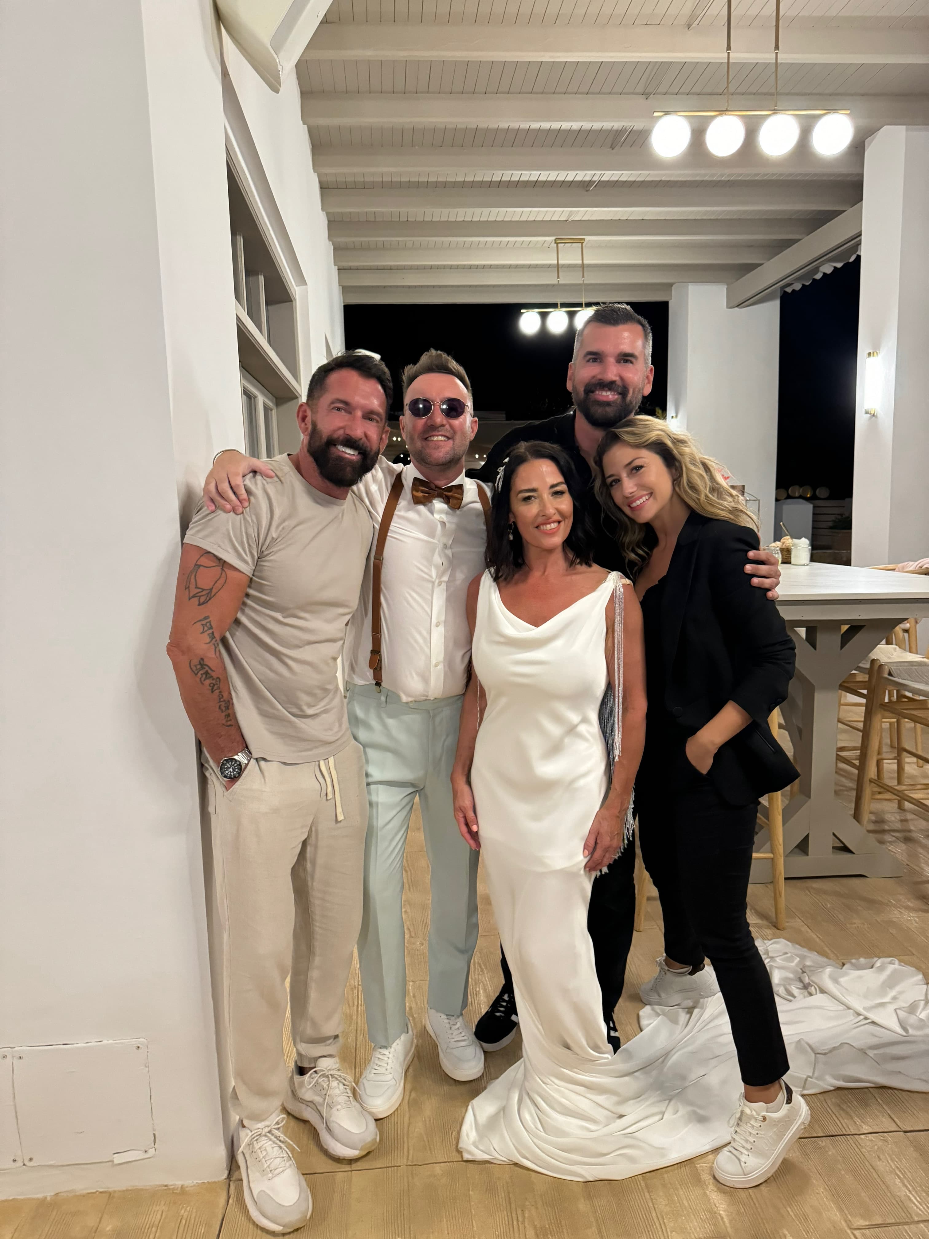 The In Love Photographers team with a bride and groom at a Mediterranean wedding venue in Ibiza